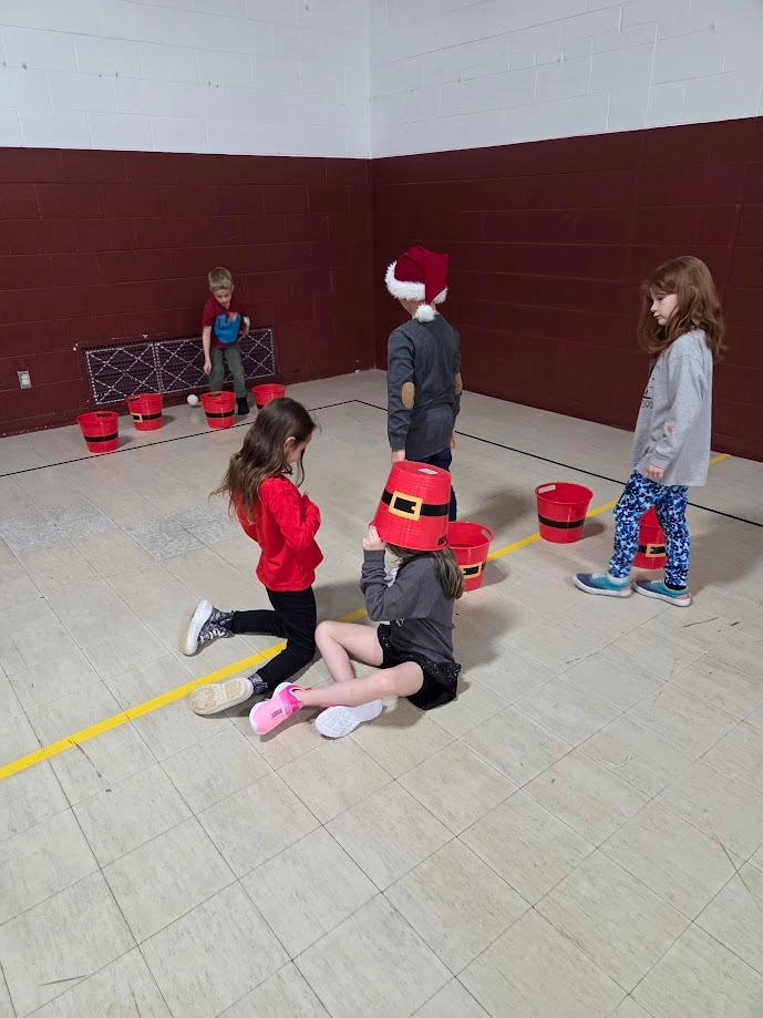 Kids playing games at the jingle bell bash.