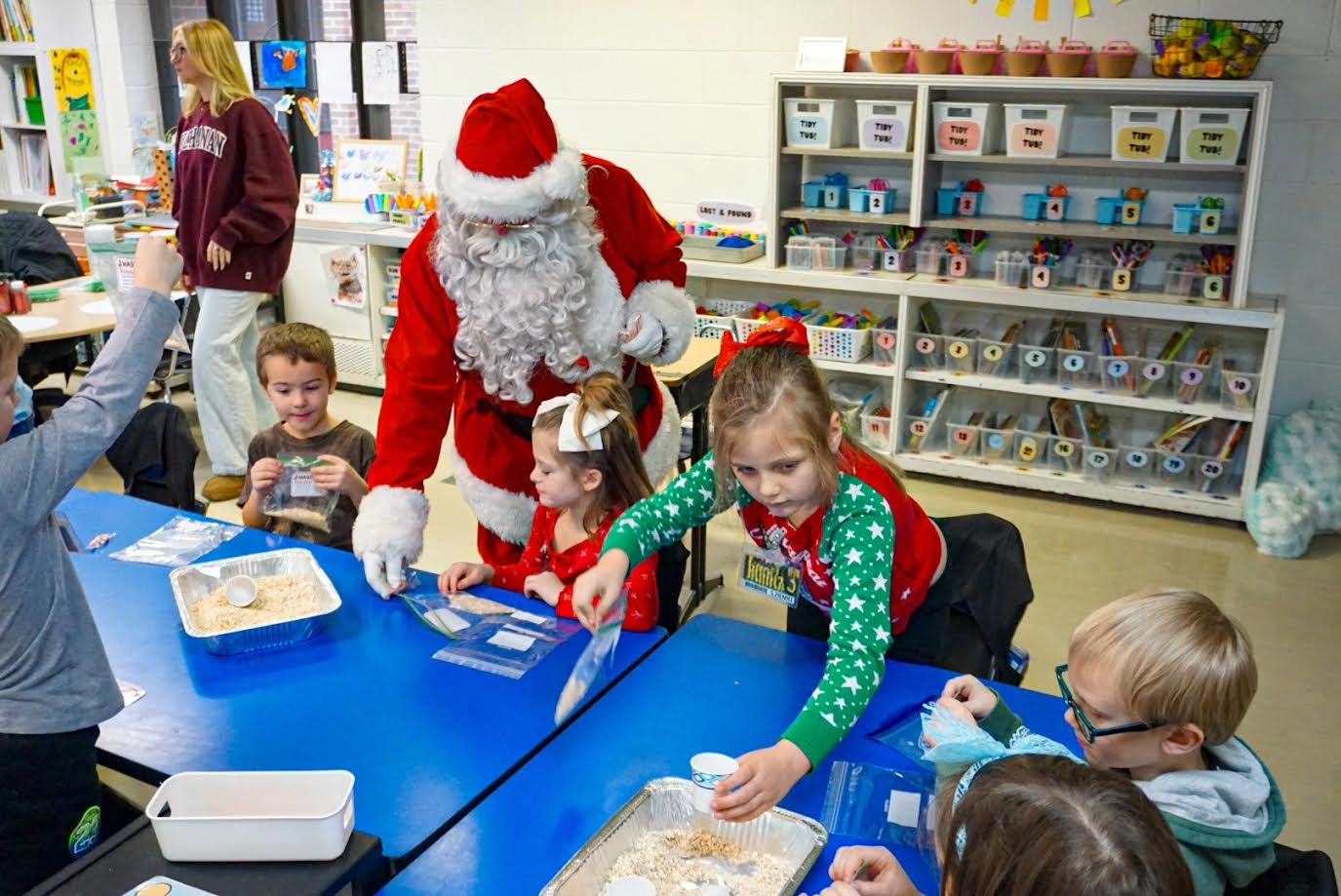 Students enjoying the jingle bell bash activities with Santa.